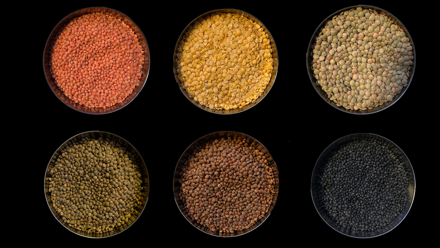 six bowls full of lentil varieties of different colors