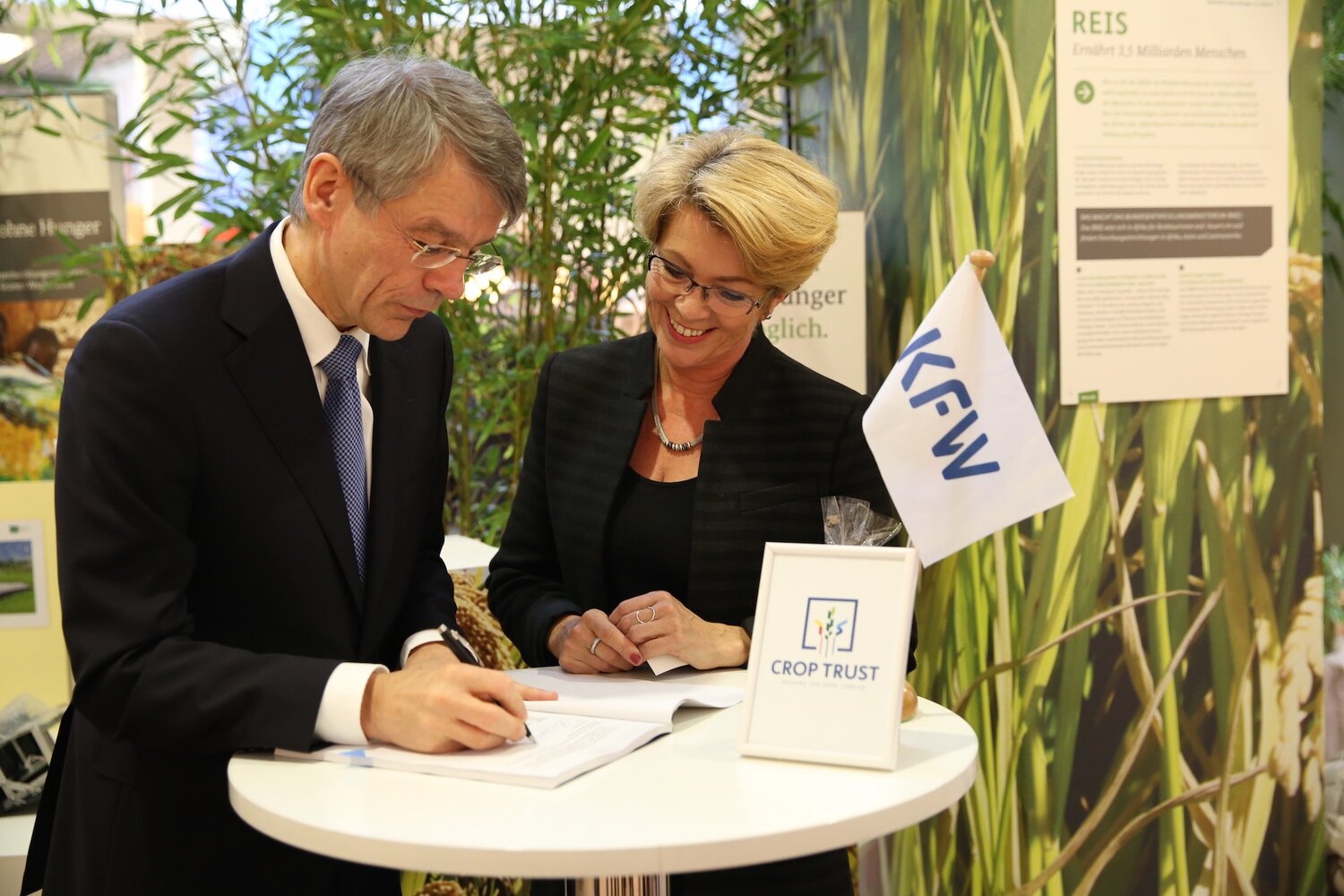 Dr. Norbert Kloppenburg, KfW Board Member, and Marie Haga, Executive Director of the Crop Trust, sign the contribution agreement
