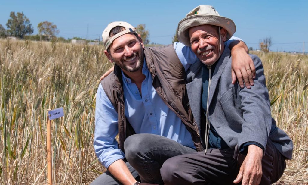 Filippo Bassi and Abdellah Bounagua posing for photo in a field. 