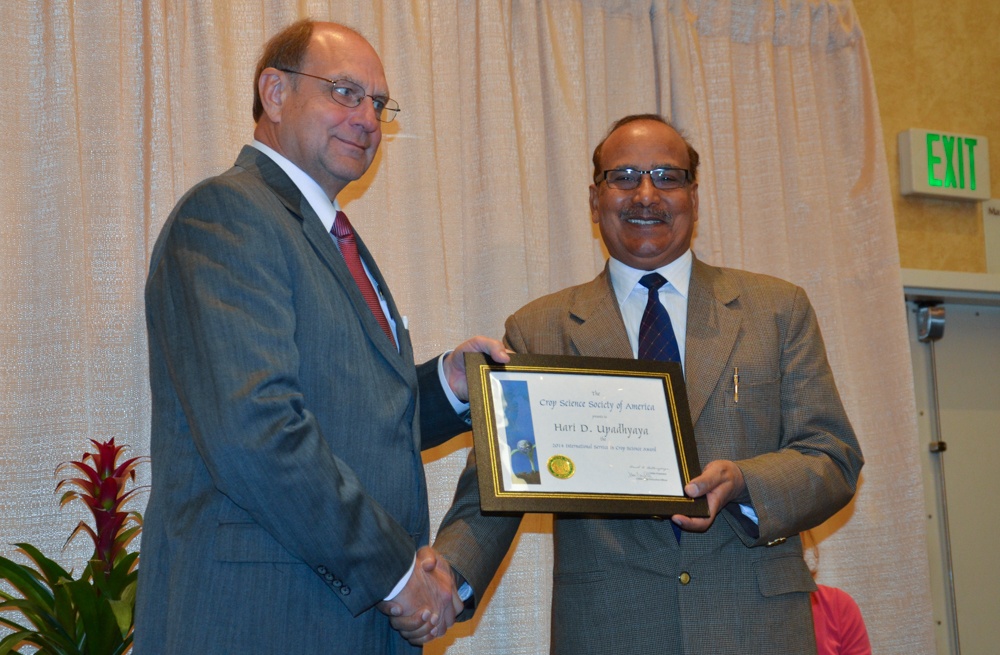 Dr. Upadhyaya recieving award.